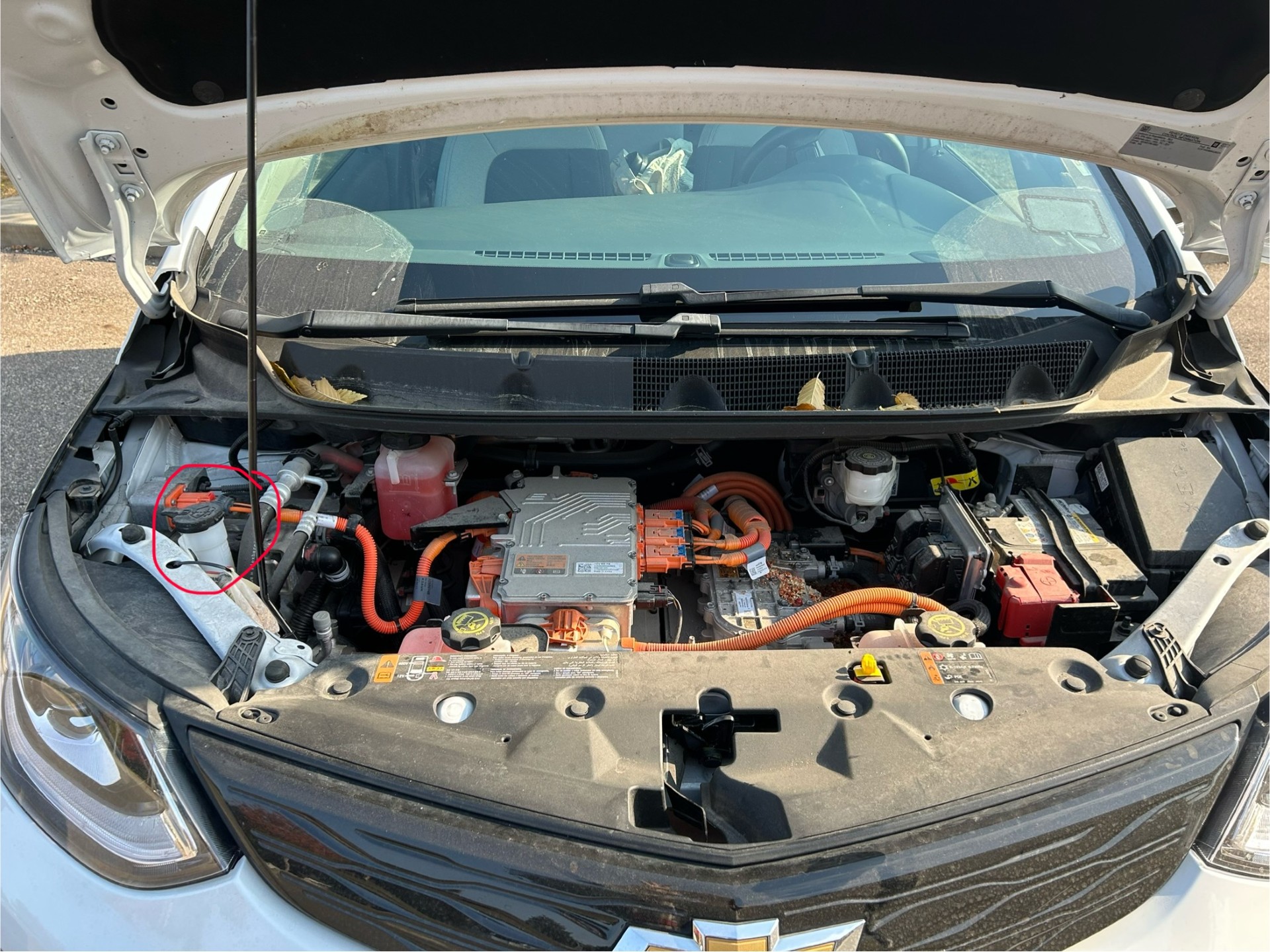 A picture showing where to put wiper fluid in a Chevy Bolt.