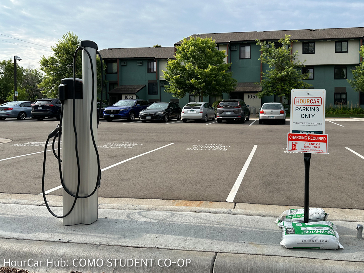 A picture showing where the HOURCARs should park: they are to the left of the three resident chargers, and nose to nose, not next to each other.