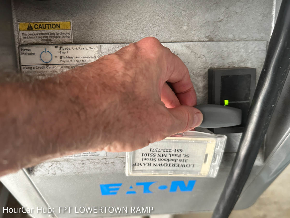 A picture of how to tap the fob on the charger.